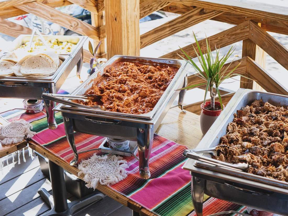Que Onda catering trays arranged for a special event.